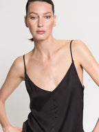 Detail of model wearing the satin Camisole in black