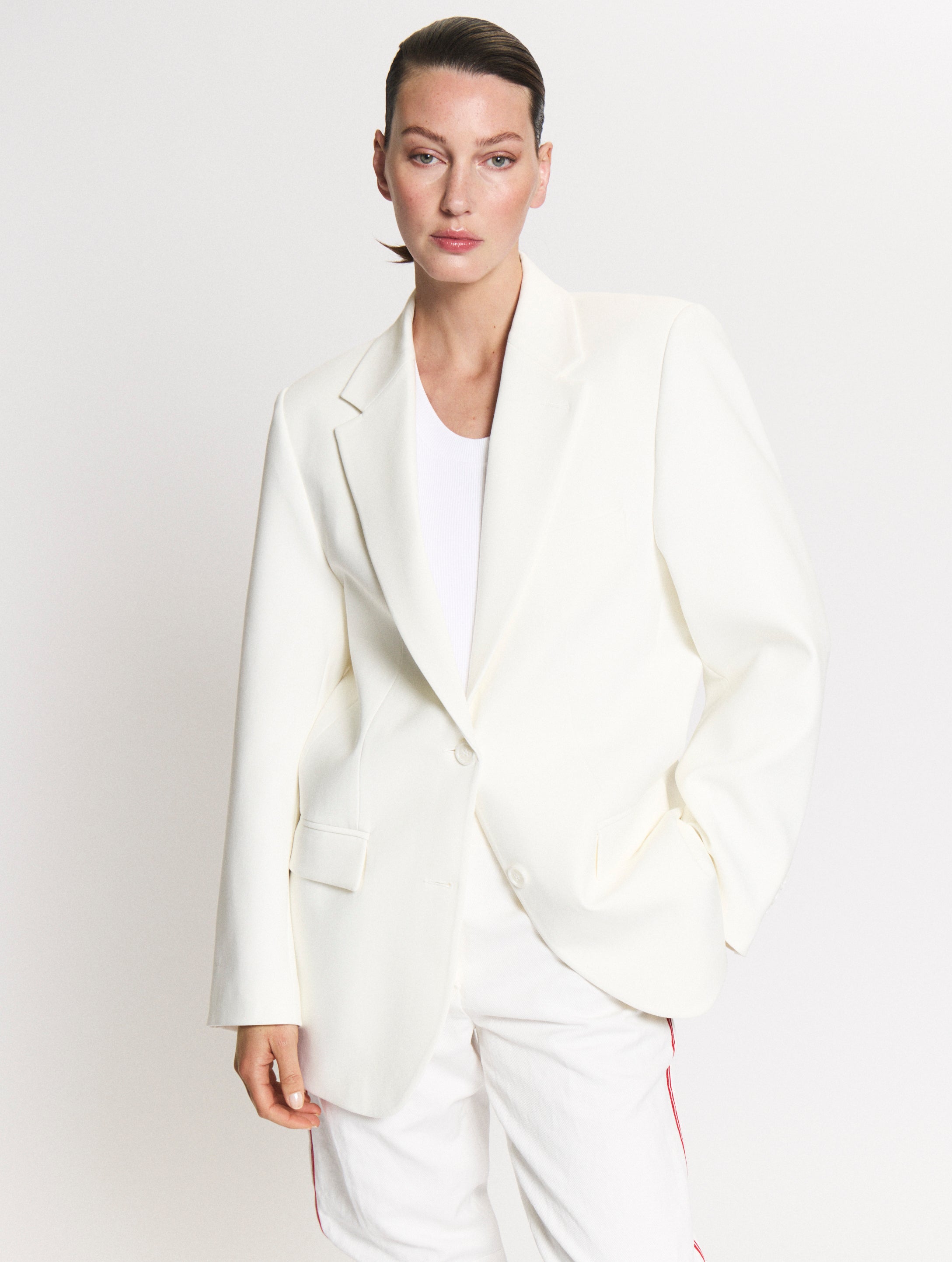 Detail of model wearing the Blazer in Off White and the Tanktop body in White