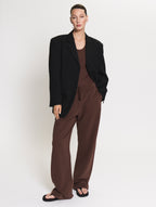 Model wearing the Blazer in black. Tanktop body in brown together with the Linda Tol jogger in brown