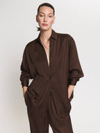 Detail shot of model wearing the brown satin set