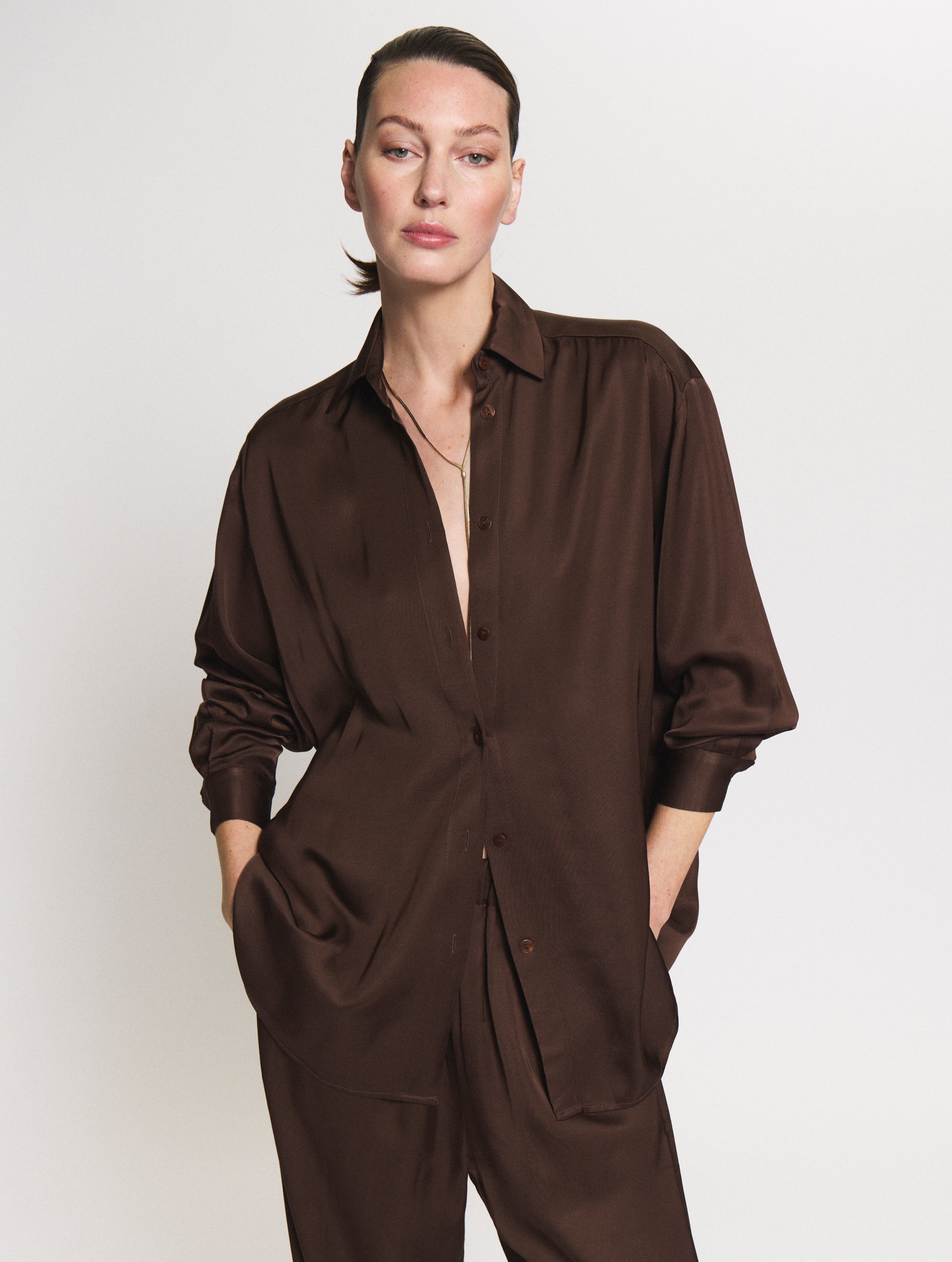 Detail shot of model wearing the brown satin set
