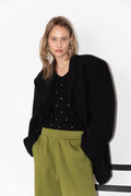 Model wearing The Love Stories x DYO Rhinestones tanktop body in black.  combined with The Blazer and Jogger in pear. 