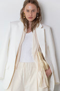 Model wearing The Love Stories x DYO Rhinestones tanktop body in white  combined with The Blazer in Off White and The Utility pants