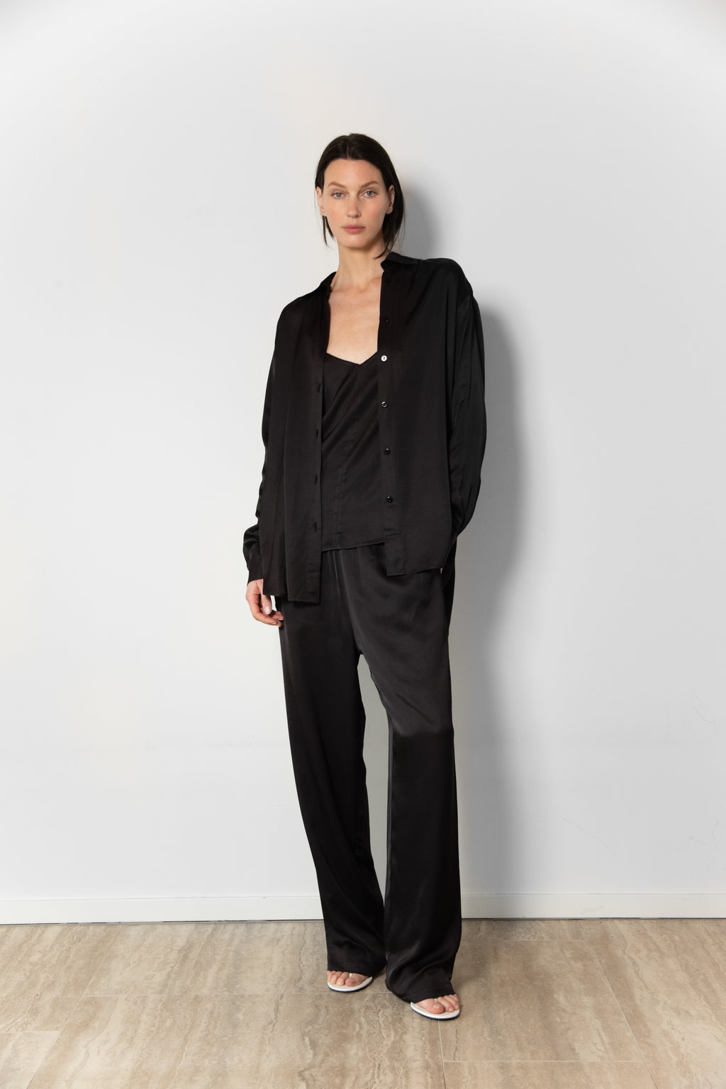 Model wearing the satin set in black
