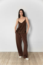 Model wearing the satin Camisole in brown together with the Linda Tol jogger in brown 